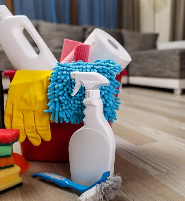 Cleaner wiping a kitchen counter